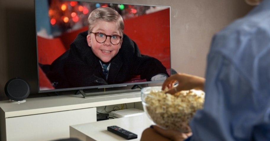 person watching A Christmas Story on a TV