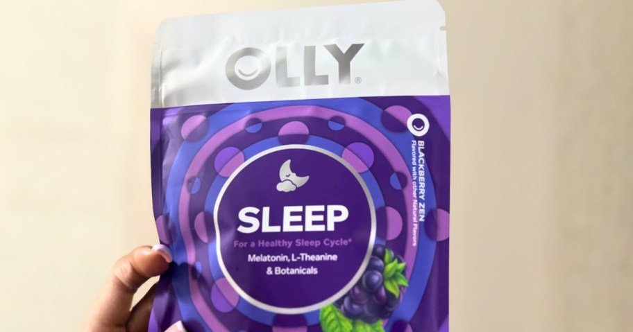 hand holding an OLLY Gummies Sleep pouch