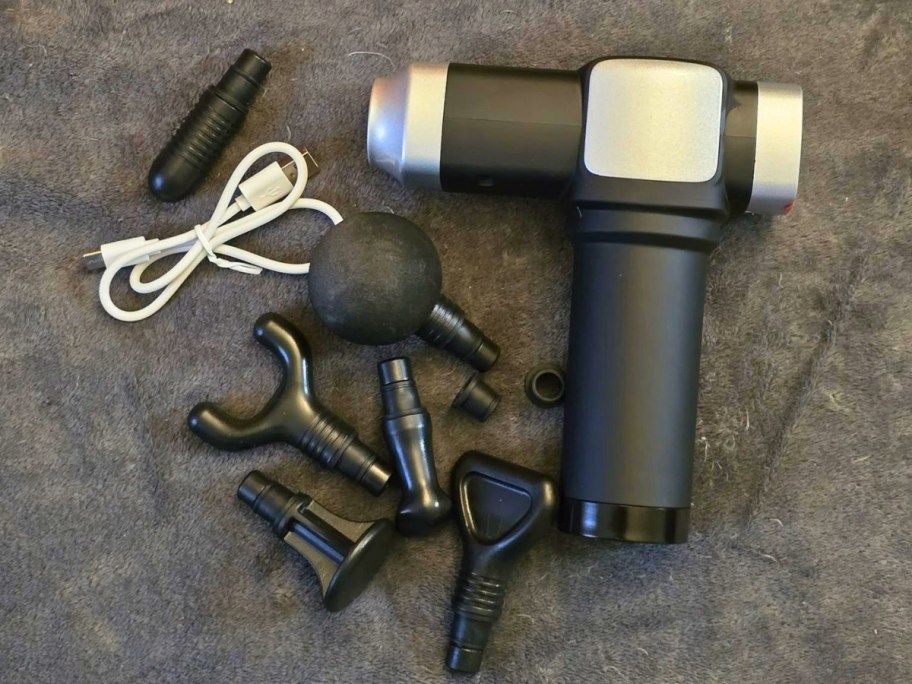 a deep tissue massage gun with multiple attachments