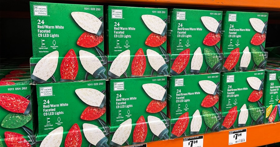 boxes of red and white christmas lights on store shelf