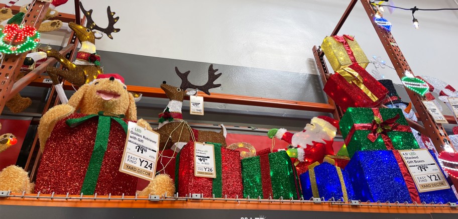 dog and gift box outdoor christmas decorations on display in store