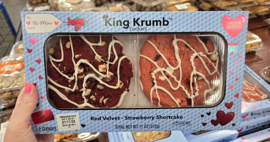 Hand holding a box of King Krumb Valentine's Day Cookies