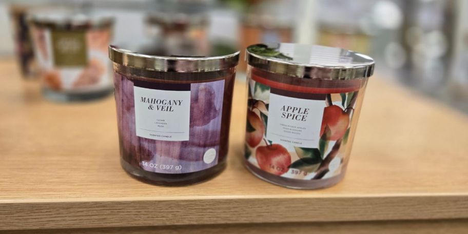 2 jar candles on a counter