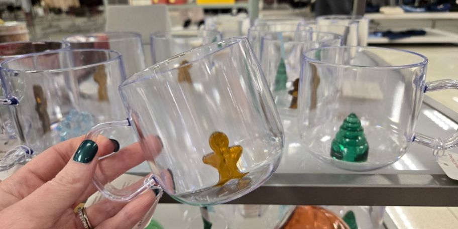 A glass mug with a gingerbread man in the bottom