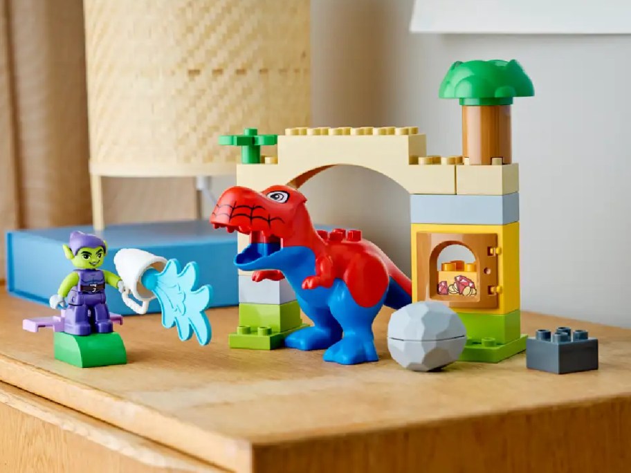 A complete LEGO spidey rex green goblin set.