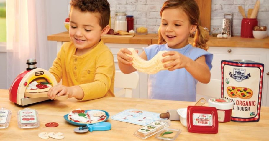 Little boy and girl playing with a Little Tikes Creative Chef Pizza Set
