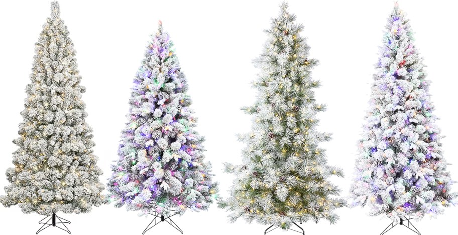 4 flocked artificial christmas trees in a row