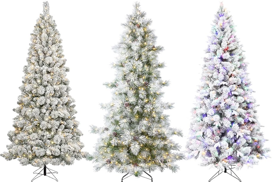3 flocked artificial christmas trees in a row