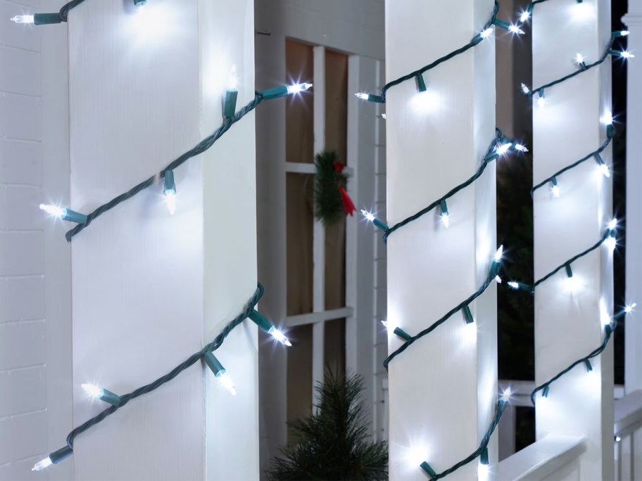 white lights wrapped around beams