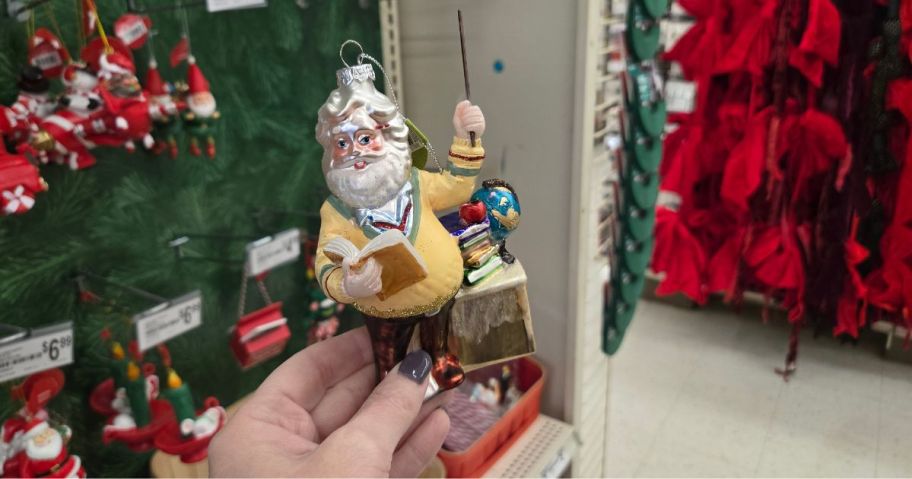 A glass Santa ornament in a store