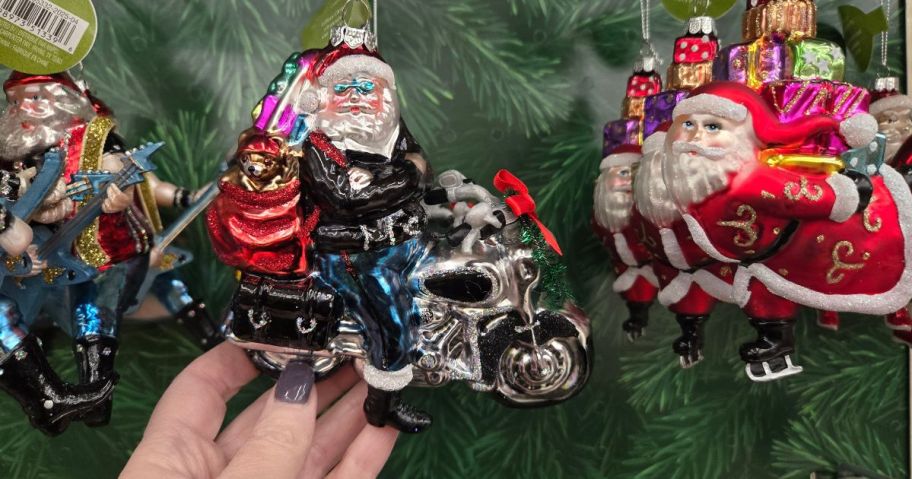 A glass Santa ornament in a store