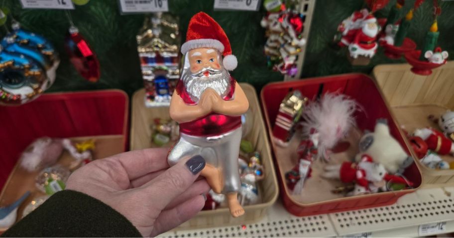 A glass Santa ornament in a store