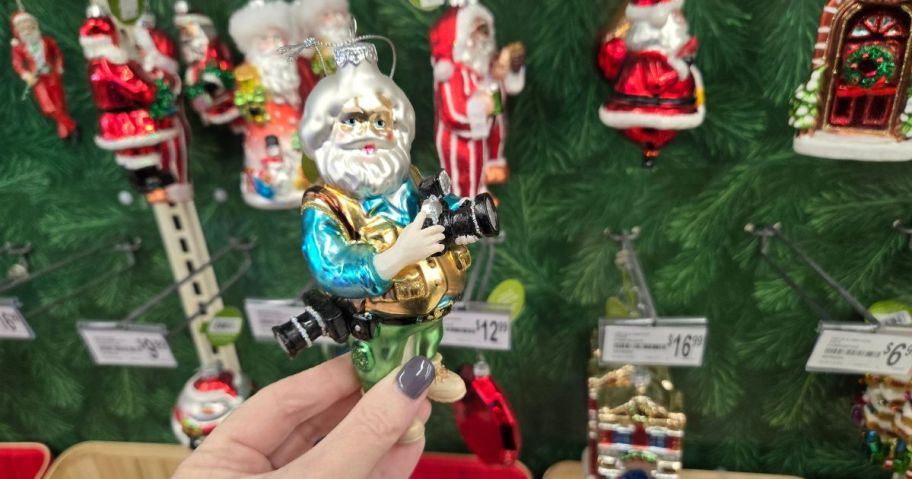 A glass Santa ornament in a store