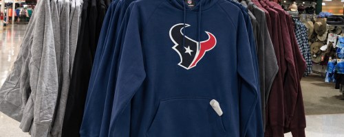blue Houston Texans hoodies on store display rack