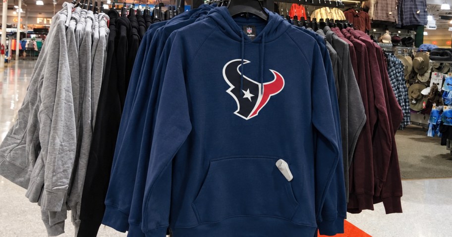 blue Houston Texans hoodies on store display rack