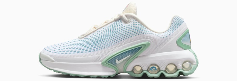 white, light blue, and green nike shoe