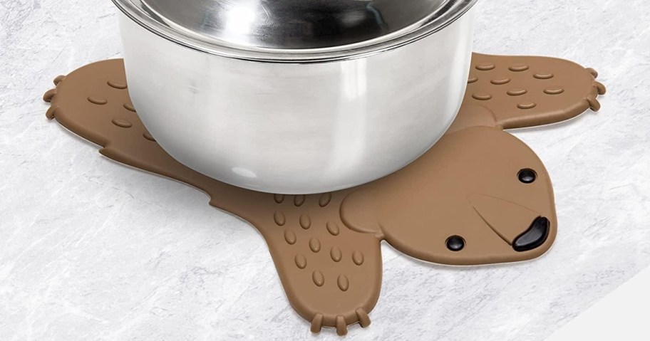 pot on top of a brown bear silicone trivet