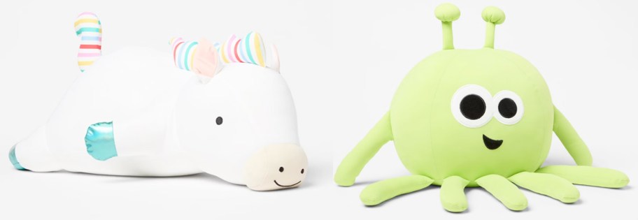 unicorn and alien throw pillows