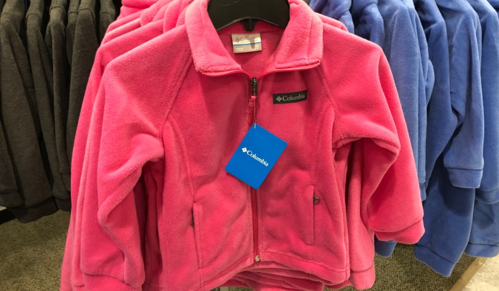 Pink Columbia fleece jacket on hanger in store