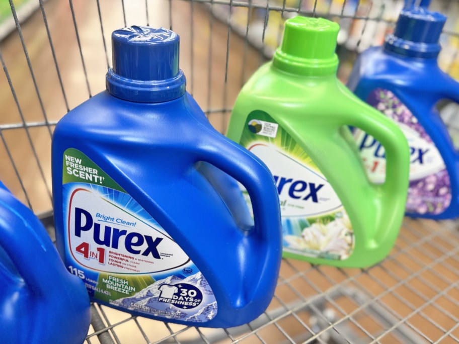 large blue and green bottles of Purex Laundry Detergent in shopping cart