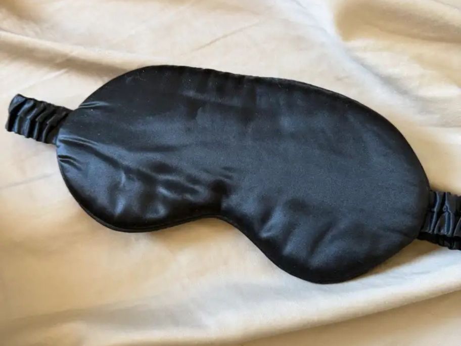 Quince Mulberry Silk Beauty Sleep Mask on bed