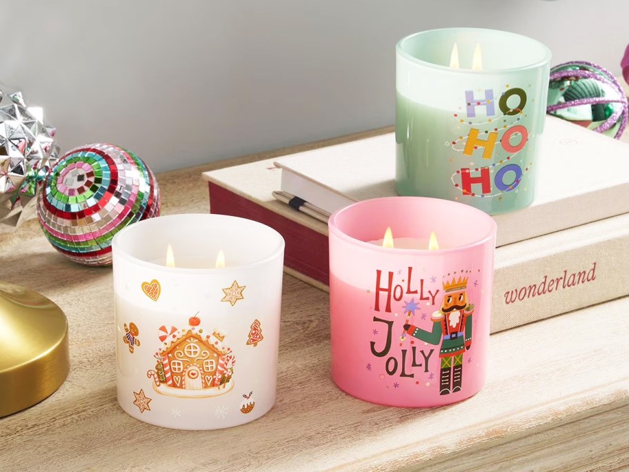 2-wick christmas candles on a wood table