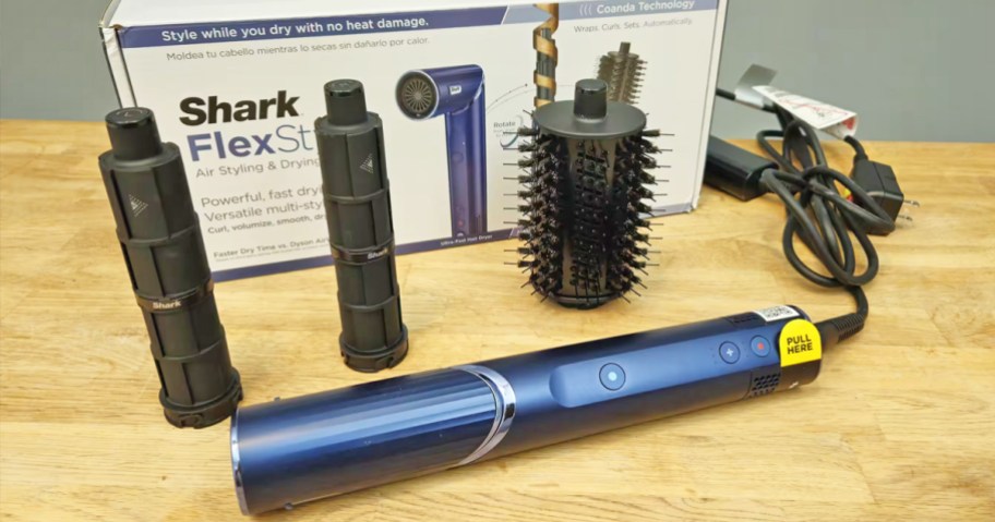 blue Shark FlexStyle with curling attachments, brush, and box on a table