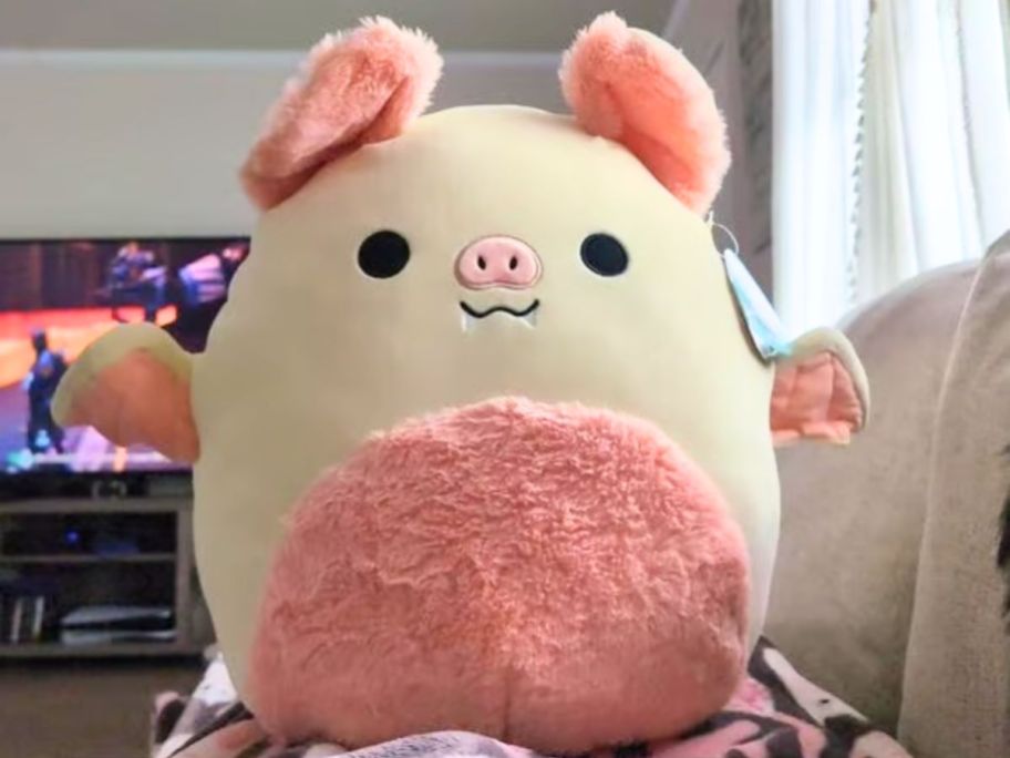Squishmallows cream and pink colored fruit bat
