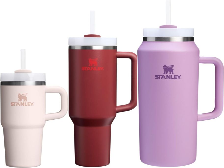 3 Stanley tumblers in pink, red, and purple