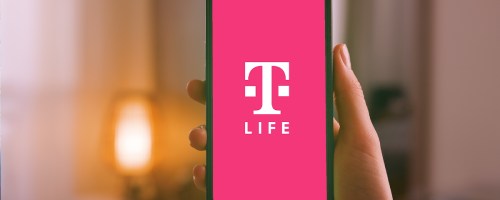 hand holding iphone displaying t-mobile t-life app
