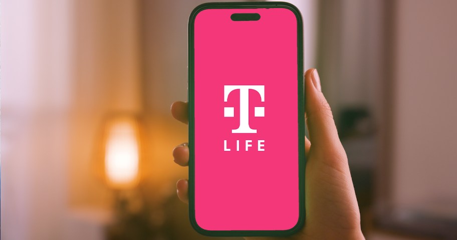 hand holding iphone displaying t-mobile t-life app