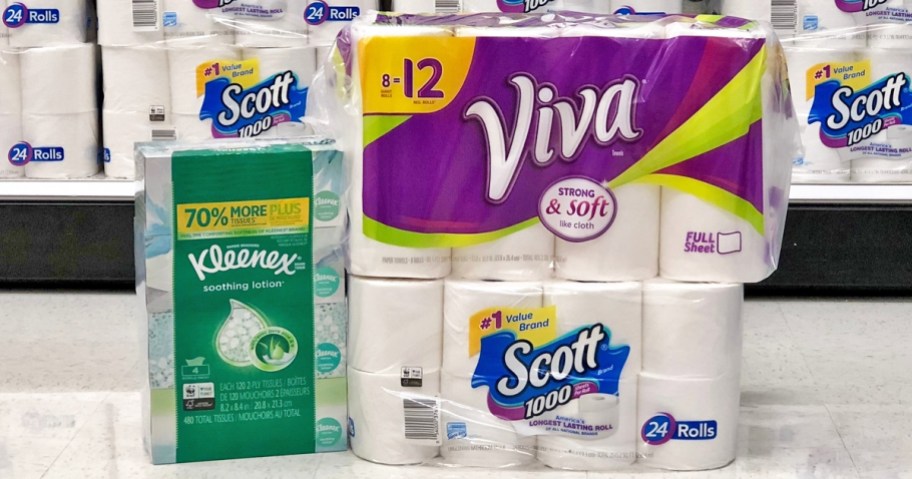 kleenex, paper towels, and toilet paper packs on floor of store