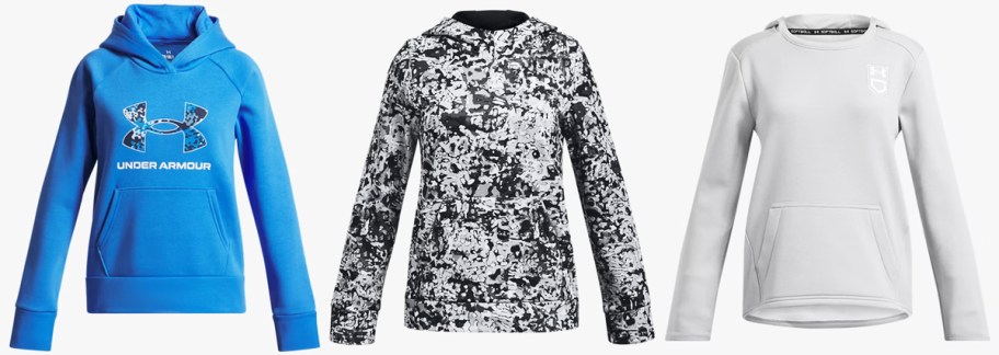 three blue, black, and white hoodies