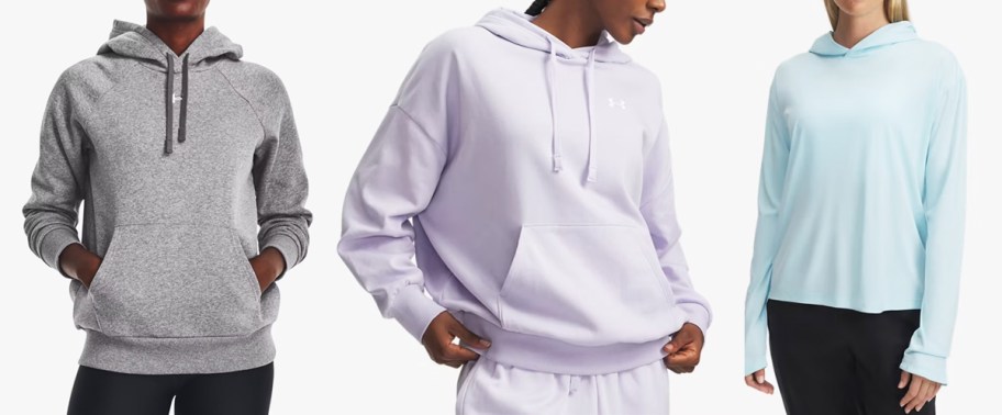 three women in grey, purple, and blue hoodies