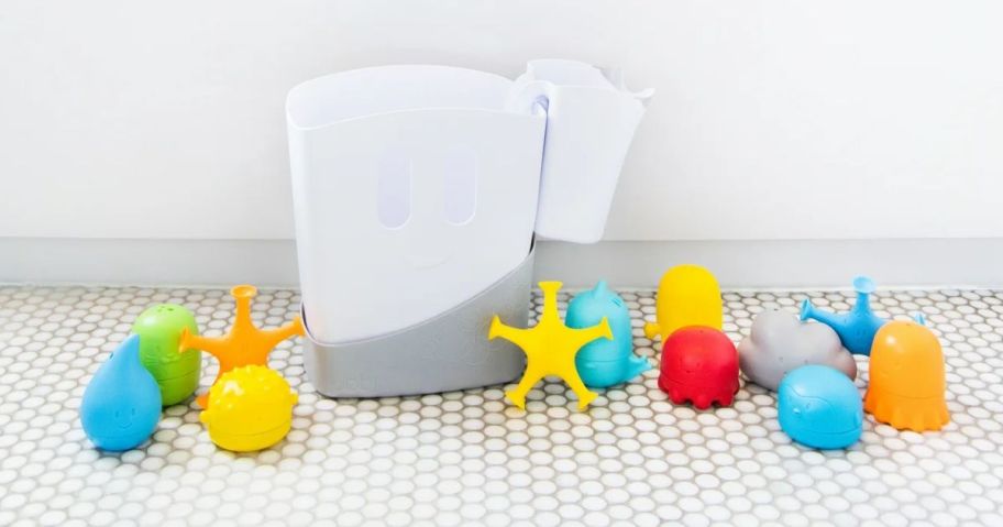 a white plastic bin with colorful bath toys surrounding it