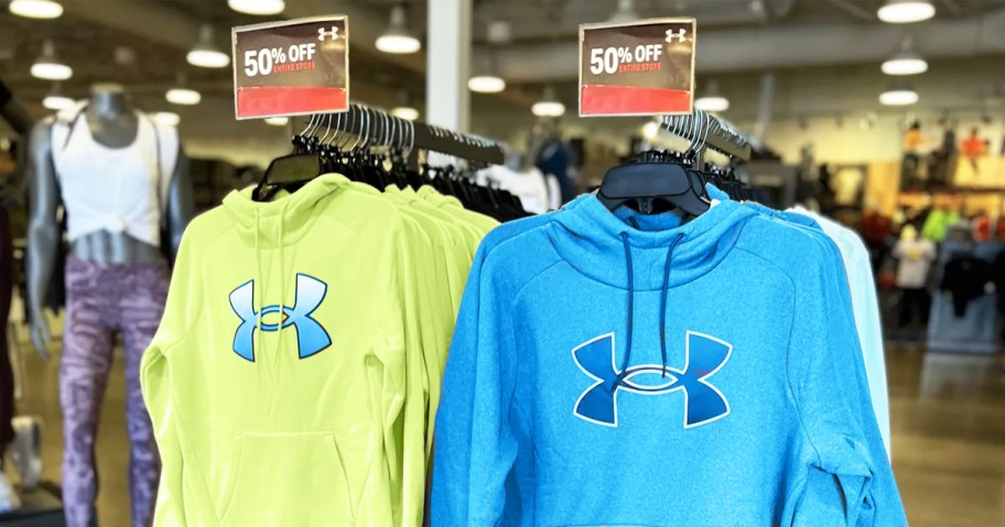 under armour hoodies on store display with 50% off sale tags
