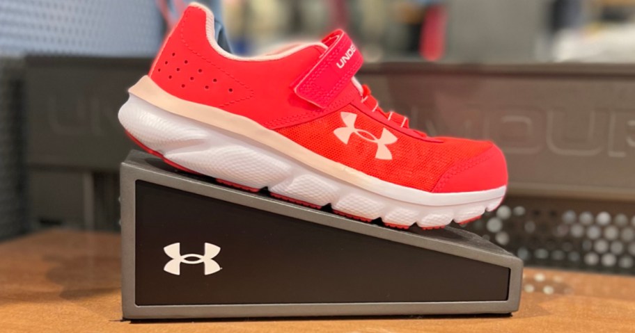 Red under Armour kids shoe on display in store