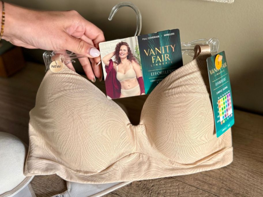 Hand holding vanity pair simple sizing bra