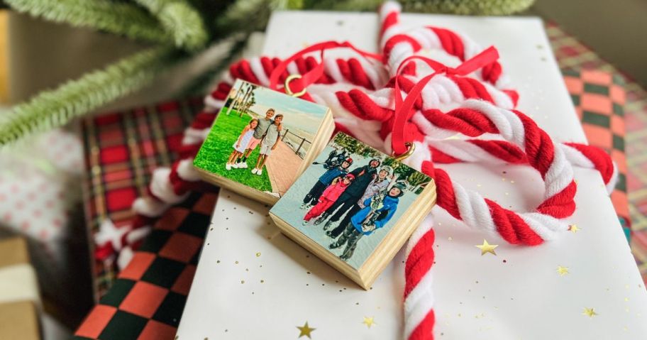 A gift with wood Walgreens ornaments on it as gift tags