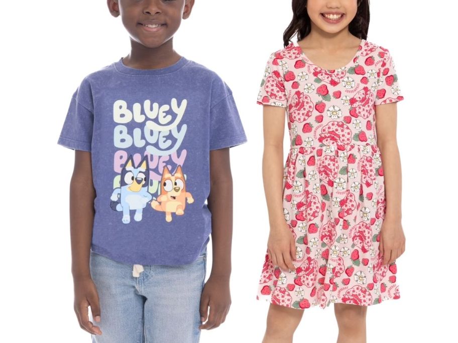 A boy wearing a Bluey t-shirt and a girl in a Strawberry Shortcake dress