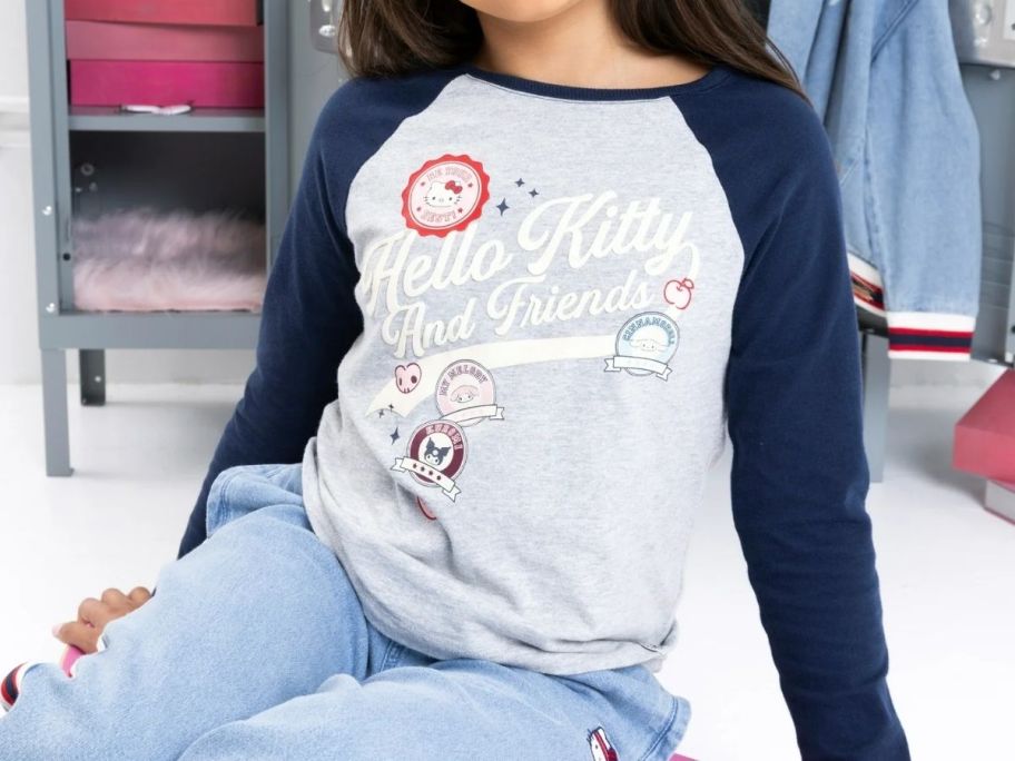 A girl wearing a T-Shirt with Hello Kitty on it