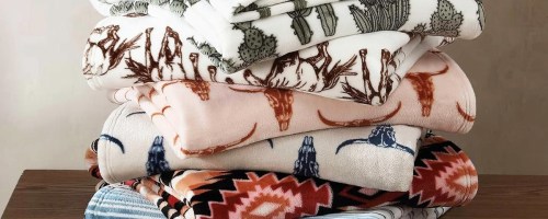 stack of folded throw blankets