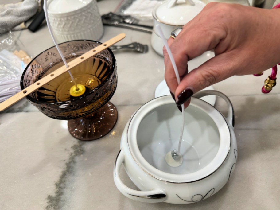 adding a candle wick to the bottom of a dish