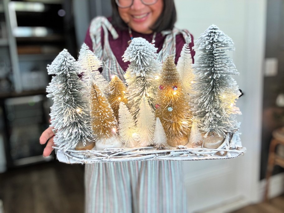 adding fairy lights to bottle brush centerpiece 