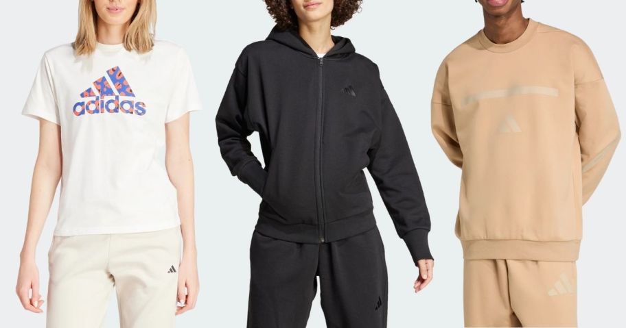 a woman wearing a white t-shirt, a woman wearing a black sip up hoodie, and a man wearing a tan sweatshirt