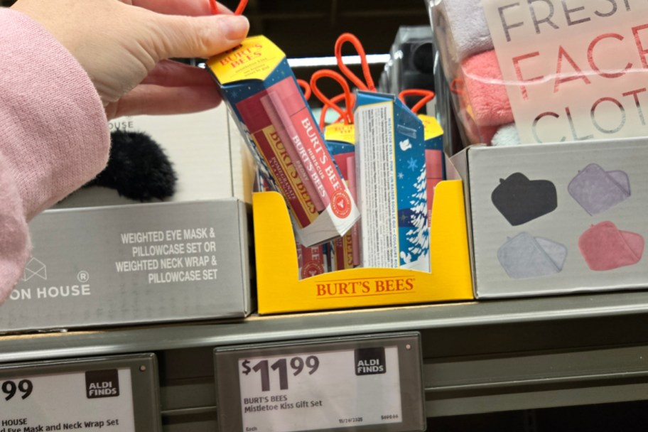 hand grabbing lip balm gift set in store