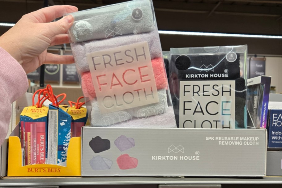 hand grabbing 5 face cloths