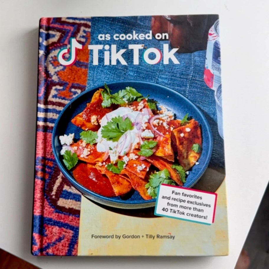 as cooked on tiktok cookbook laying on white counter