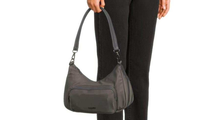 woman holding a baggallini bag