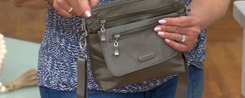 baggallini bag in womans hands